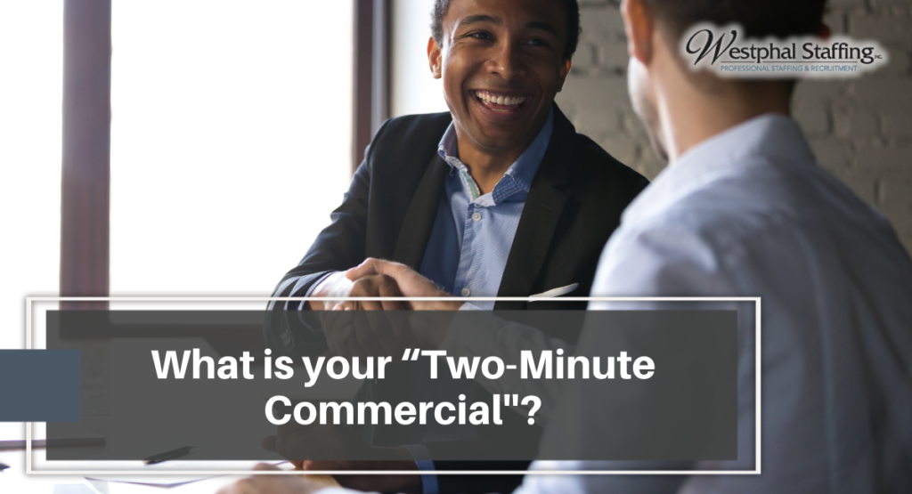 Two professional shaking hands whilst smiling