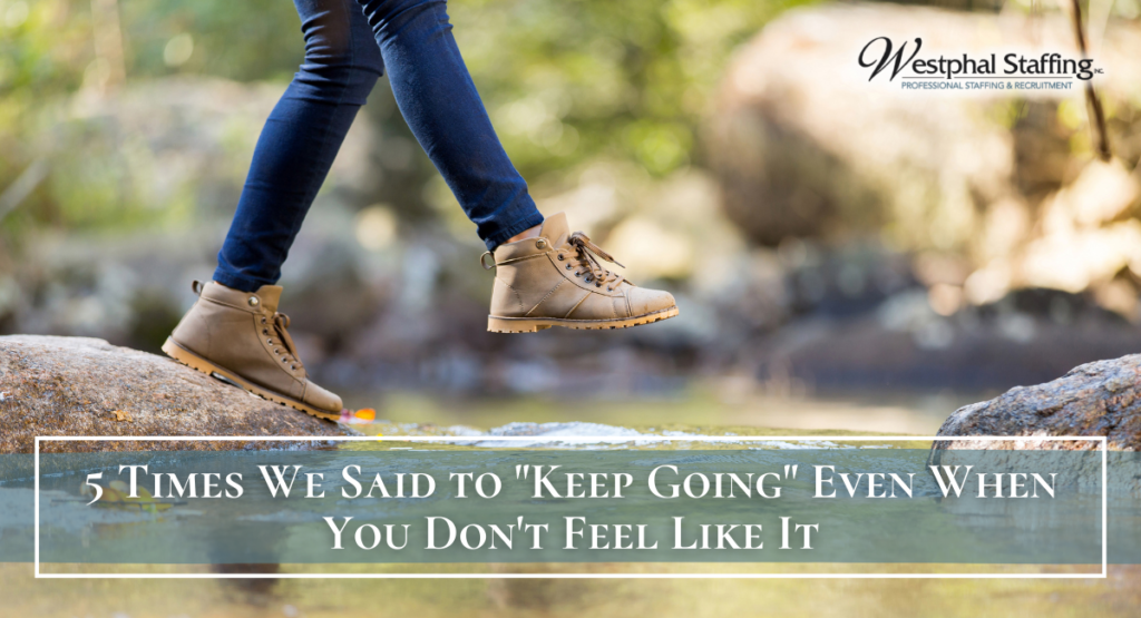 Close of woman oping over rocks while crossing a river