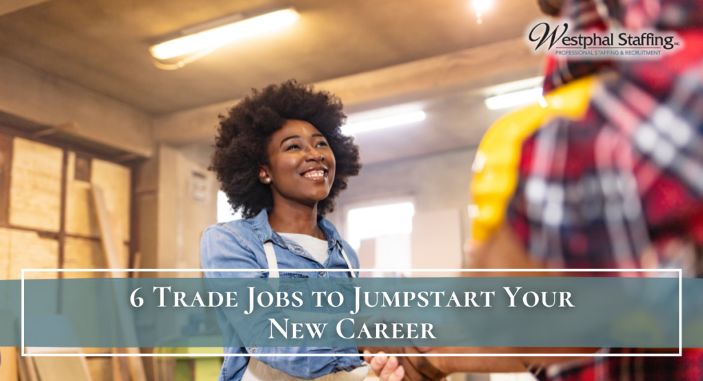 Young woman entering trade job, while shaking hand with another trade worker