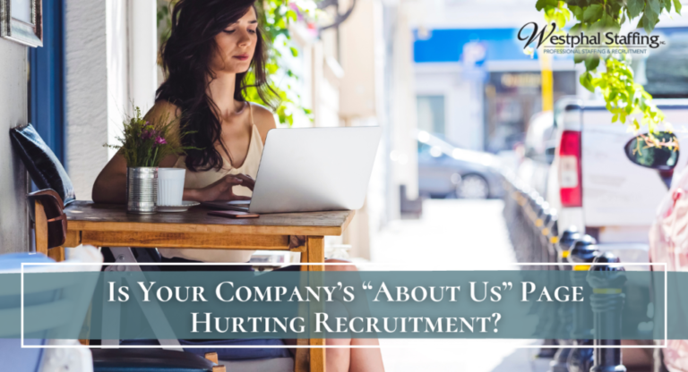 Female worker outside a restaurant on her laptop
