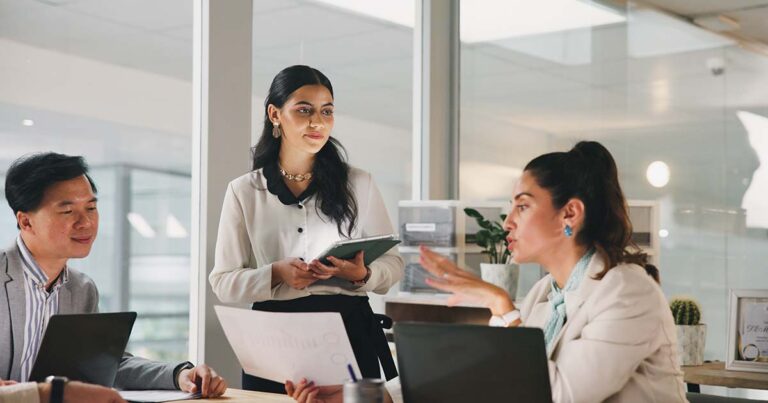 Group of employees collaborating a conference room