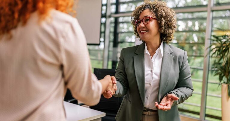 Human Resource worker congratulate new employee after job interview