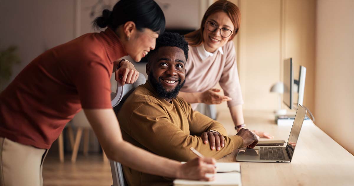 A group of professionals working together and sharing ideas in a contemporary workspace