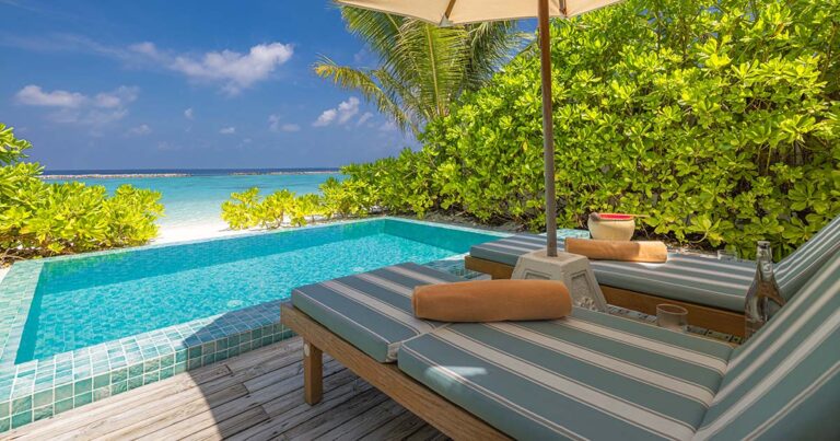 Fantastic private villa, terrace view with sun beds chairs under umbrella, luxury pool hotel stunning summer pattern.