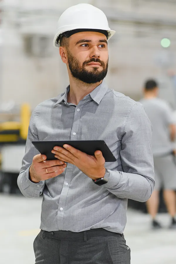 Manufacturing working on his tablet