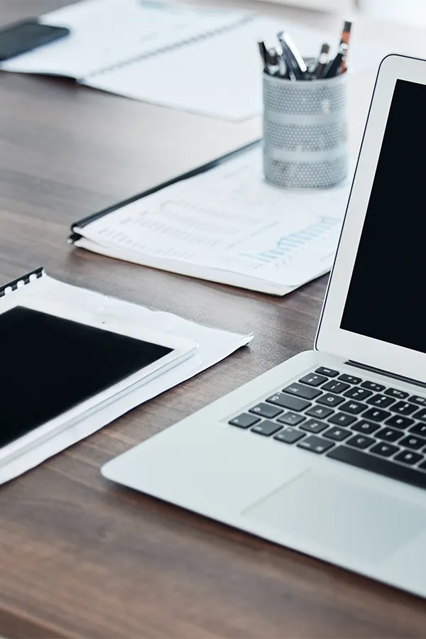 Close of corporate meeting able with note pads and computer